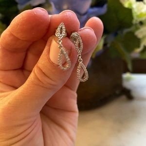 Diamond and 14-karat white gold earrings.